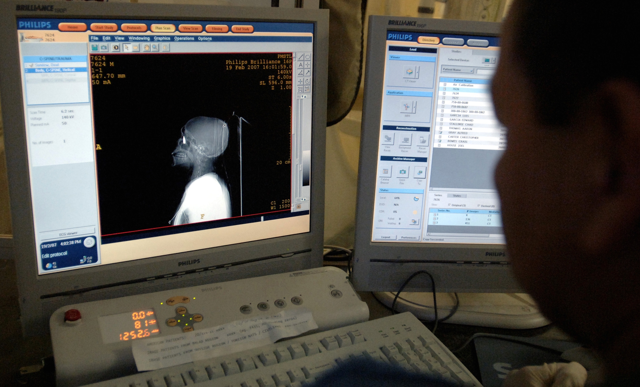 Modern 16-slice CT scanner in a hospital radiology department, showing the gantry and patient table